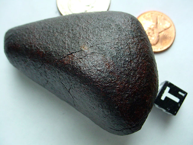 See Explanation.  Clicking on the image will download an image of the opposite side of this meteorite.